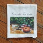 18 x 22 Flour Sack Tea Towel 100% cotton with Ocracoke Fig Cake artwork by Karen Rhodes